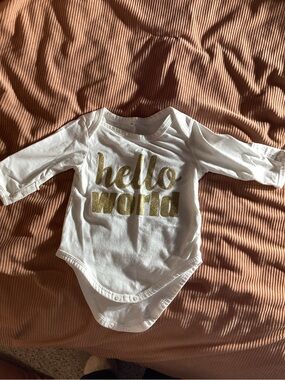 White Long-Sleeve Baby Bodysuit with Gold 'hello world' Text hand covers